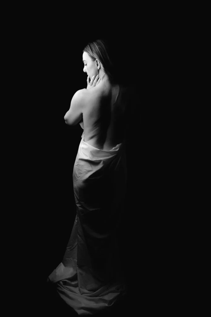 From behind, the fabric falling