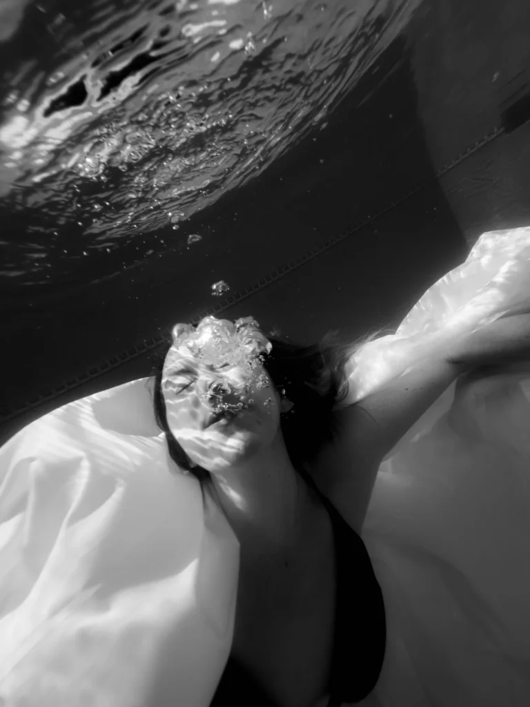 Bubbles over her face, in black and white