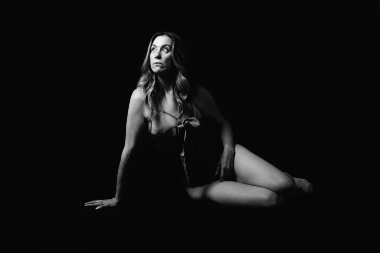 Reclining in the dark, in black and white