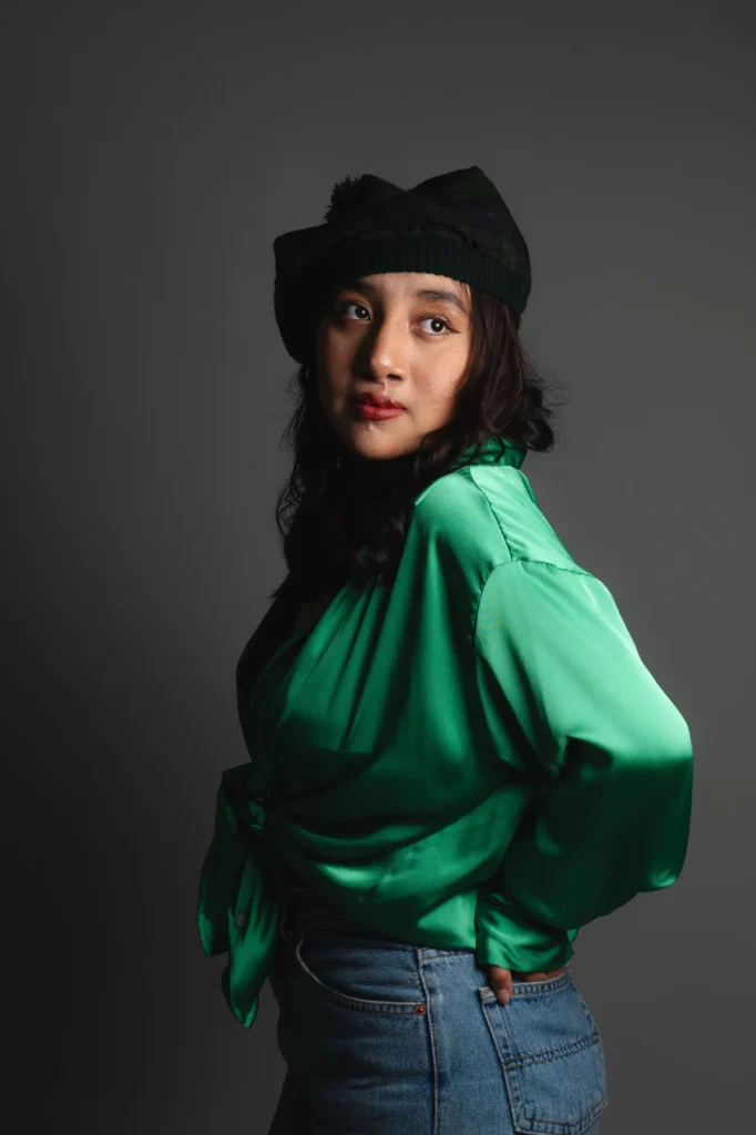 Green satin and a cap: an editorial profile
