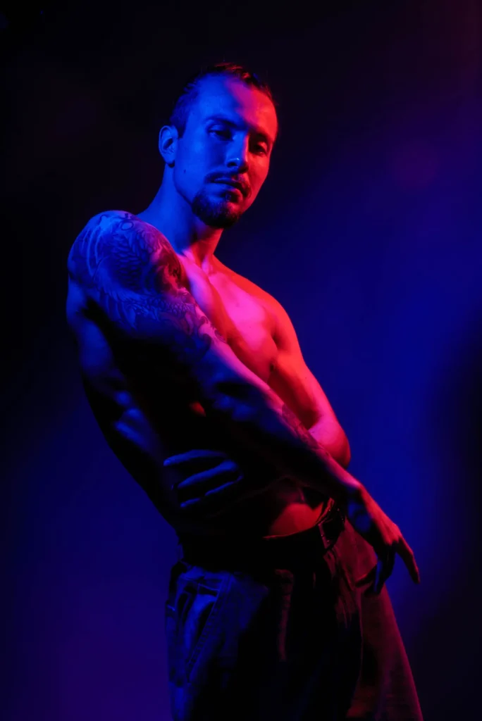 A glance to the camera in red and blue light