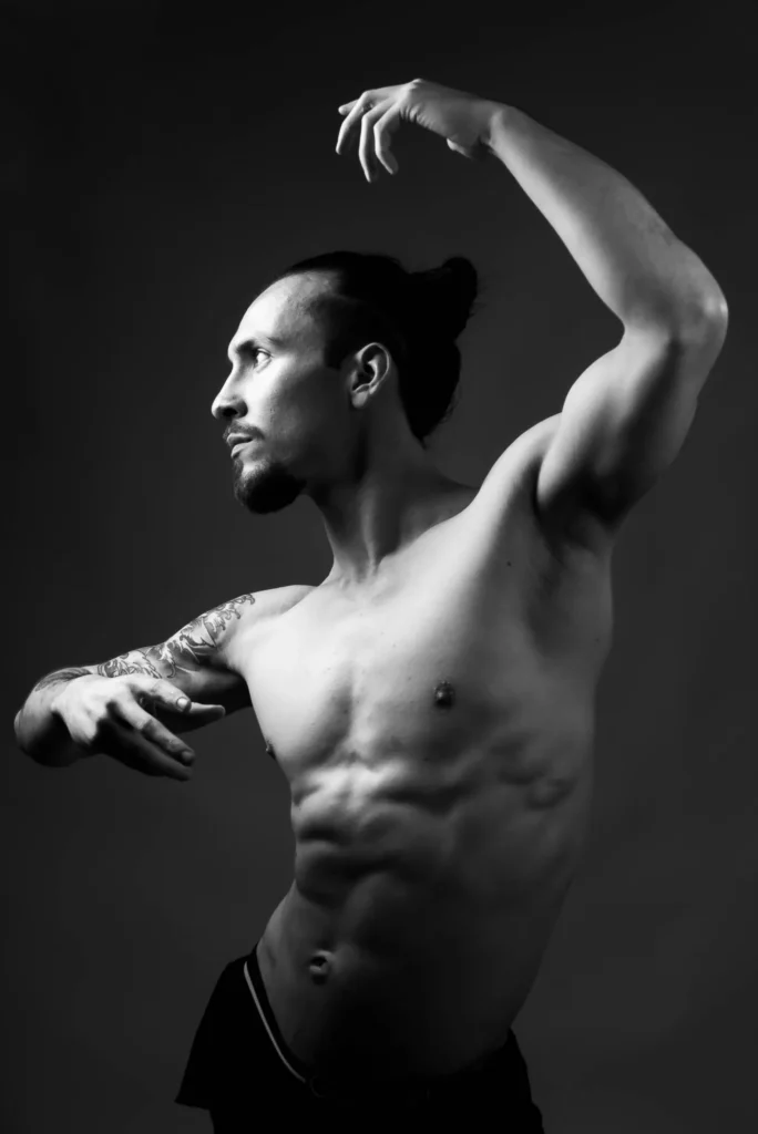 Arms in an arc, in black and white