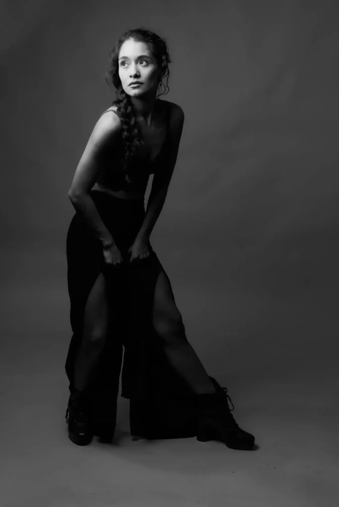 Leaning forward, in black and white