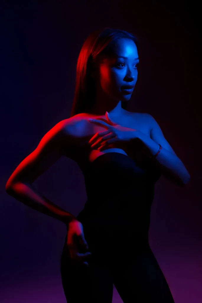 Red and blue light, black dress
