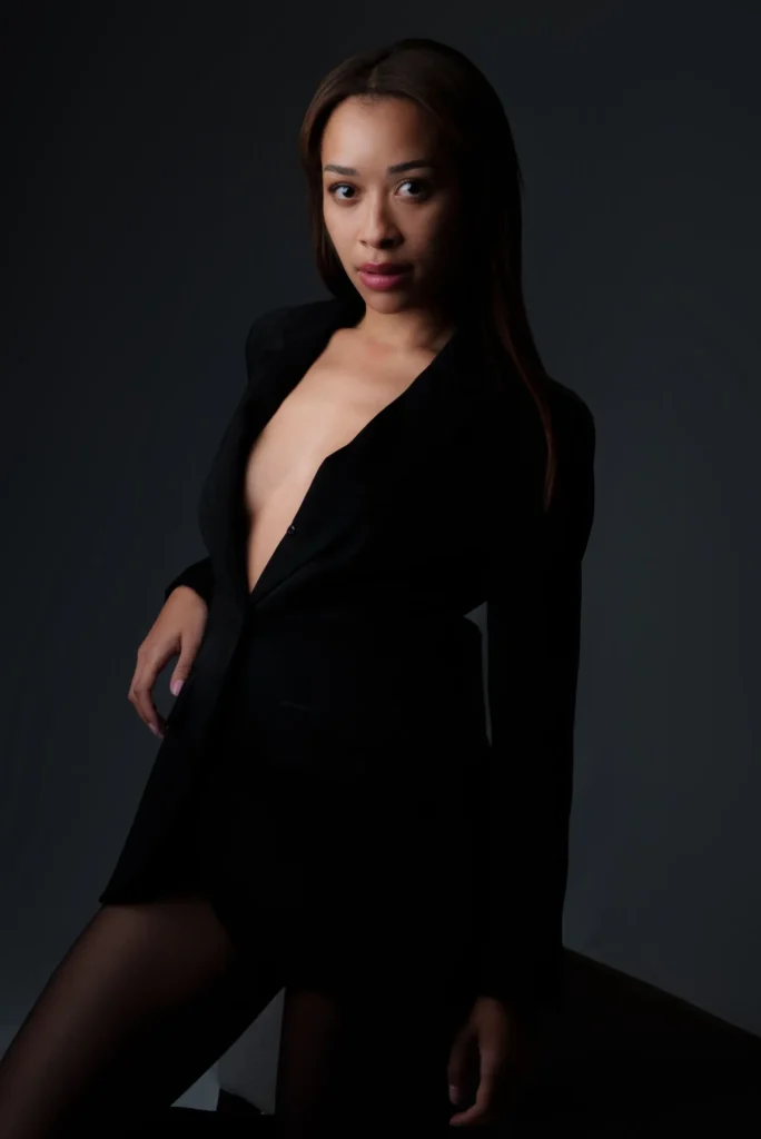 An open black blazer, a sideways look
