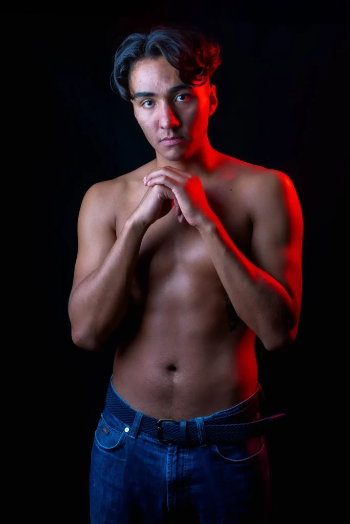 Hands together, in red light