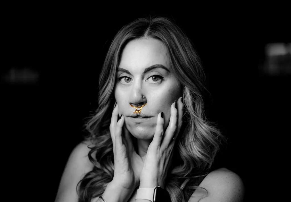 Ashley, hands on her face