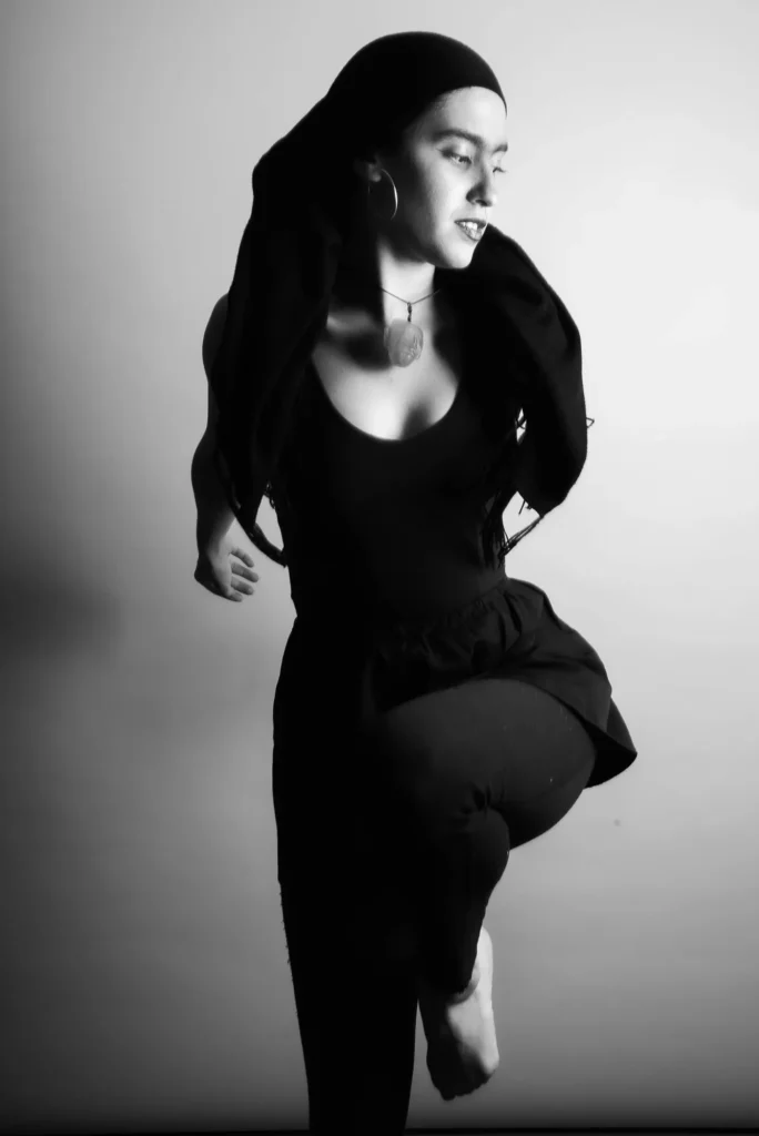 A dance pose, in black and white