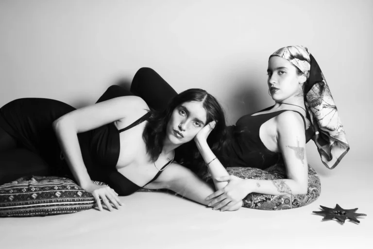 Reclining together, in black and white