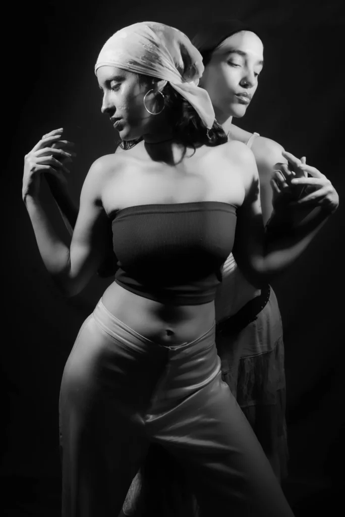 One behind the other, in black and white
