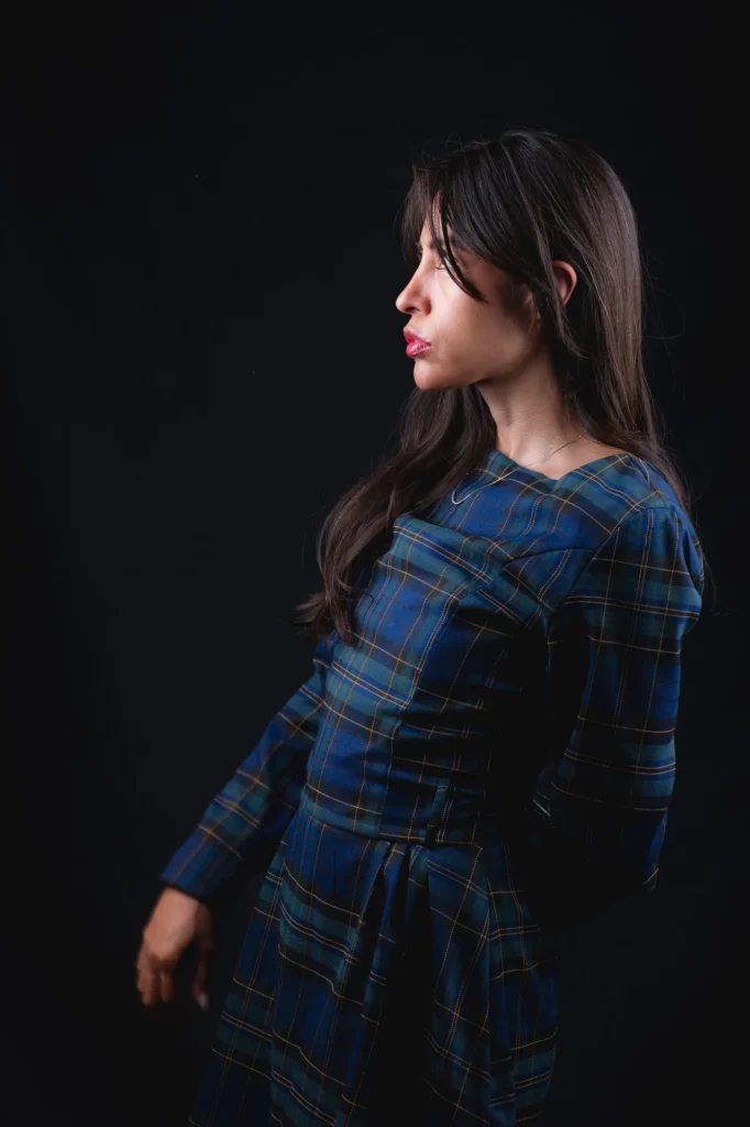 A plaid dress, in profile
