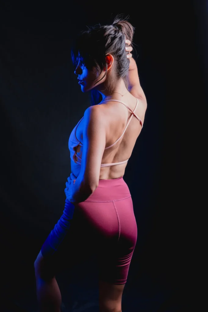 From behind, in blue light