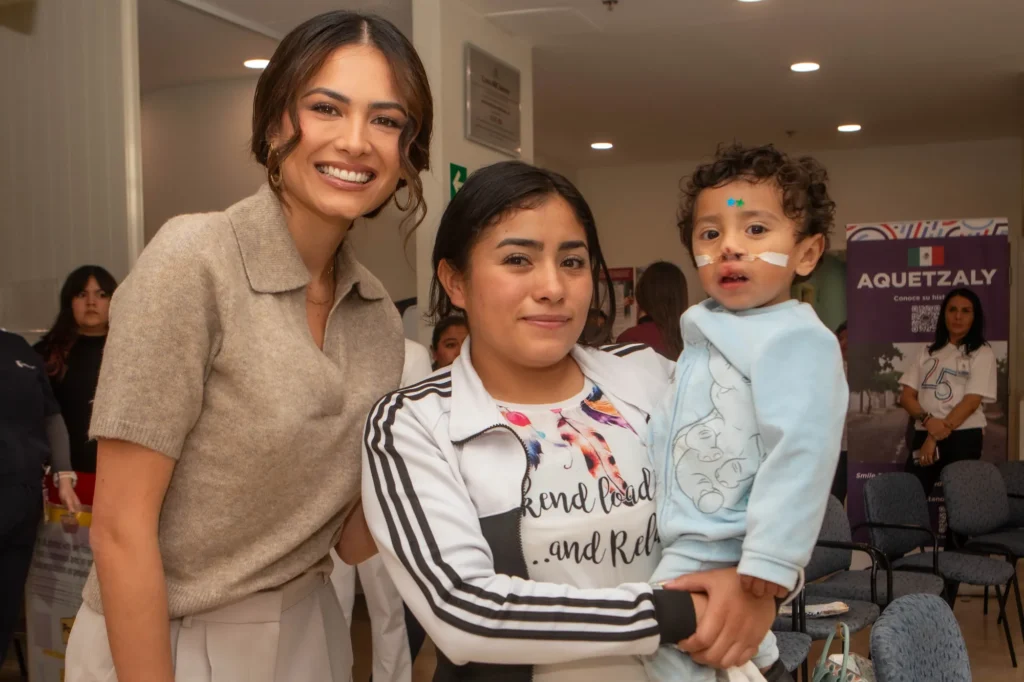 Andrea Meza with a mother and her baby