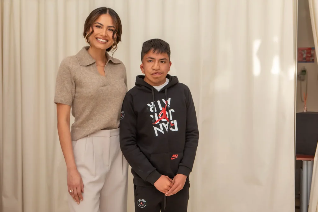 Andrea Meza with a teenager