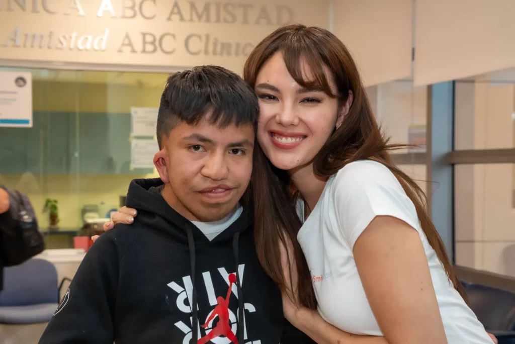 Catriona Gray with a teenager