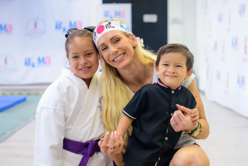 Charlotte with two students at the end of class