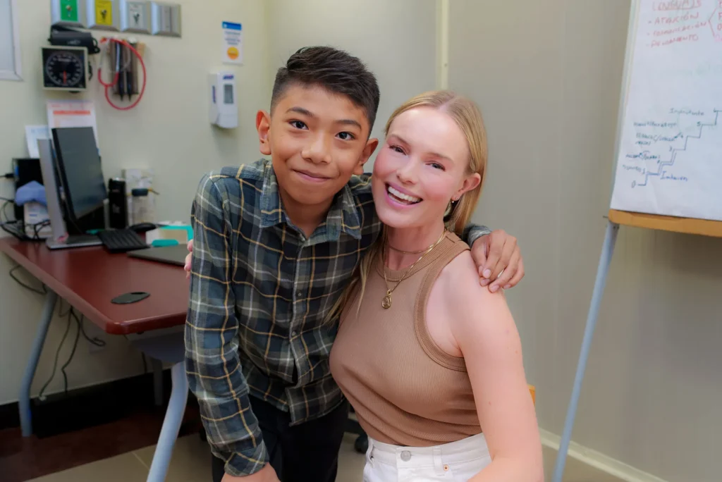 Kate with a boy in a plaid shirt