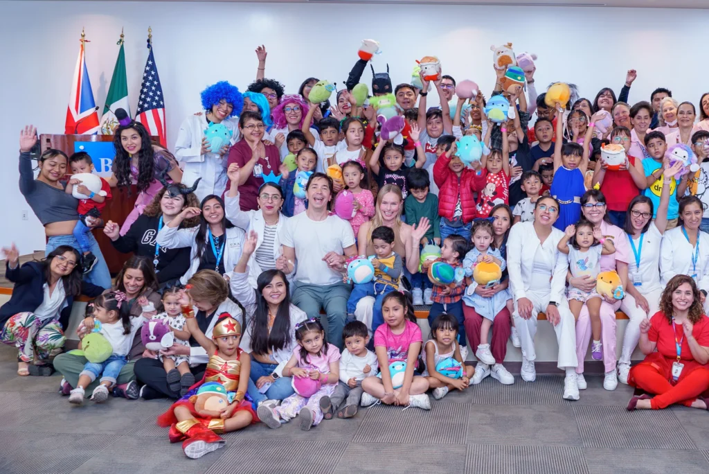 Group photo with flags at the Smile Train gathering