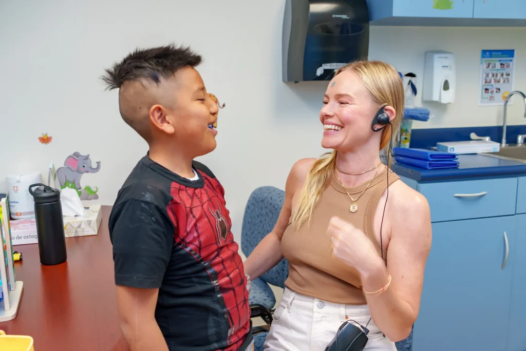 Kate and a boy laughing together