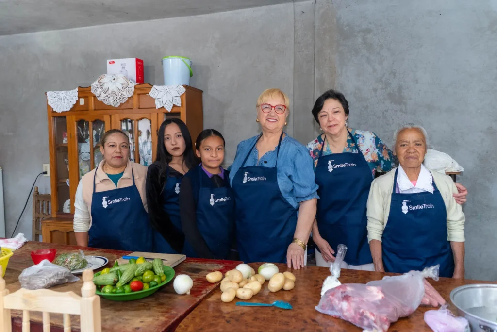Everyone in aprons, ready to cook