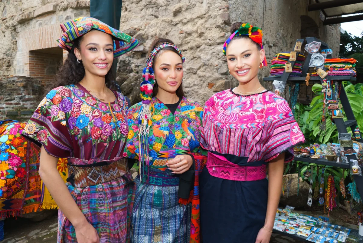 The three titleholders in traditional Guatemalan dress