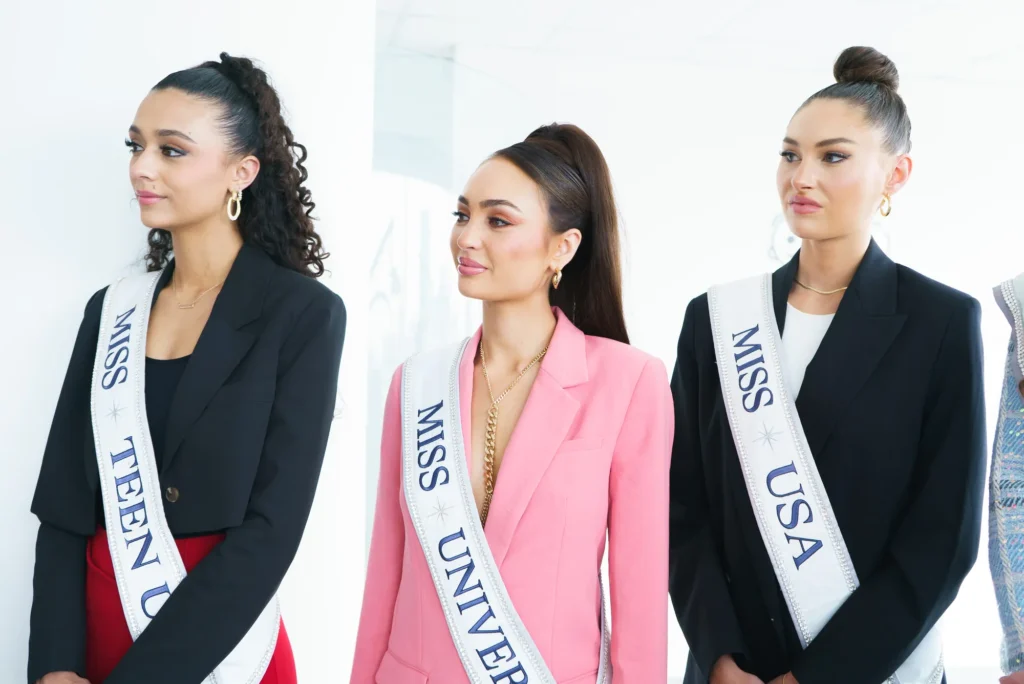 The titleholders with their sashes