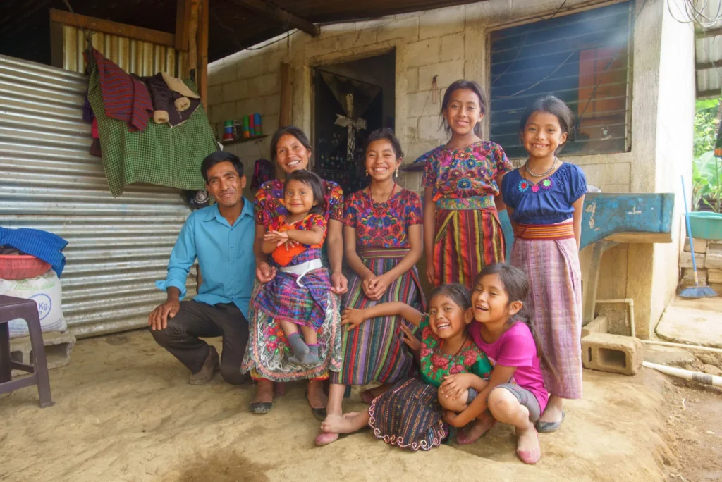 A family outside their home