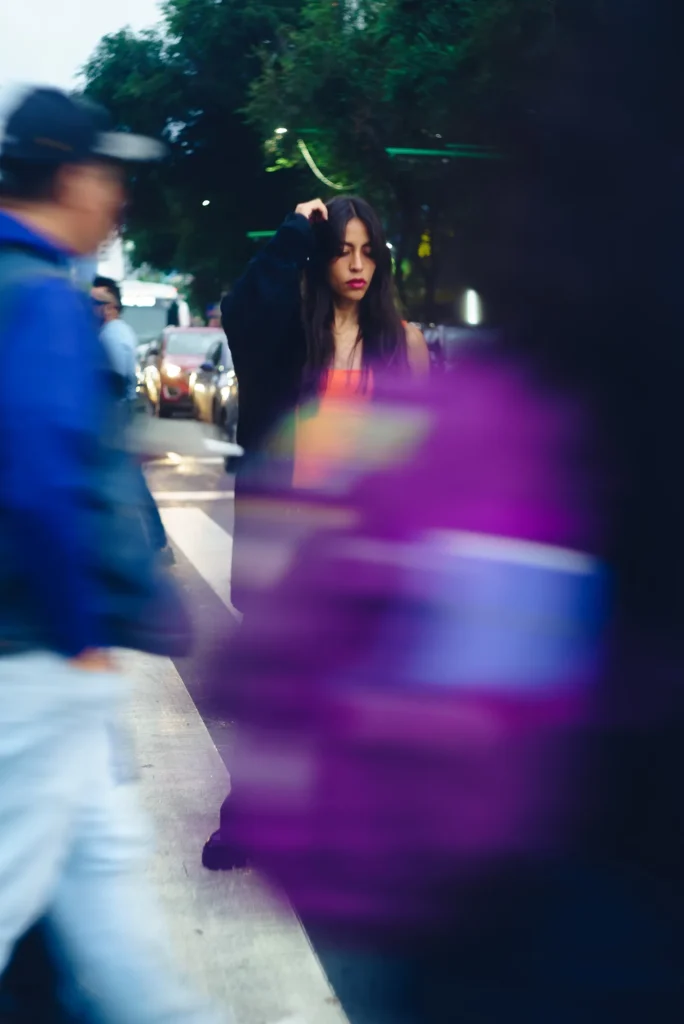Behind the passersby, in blur