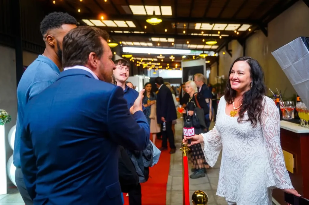 Guests greet each other as they arrive